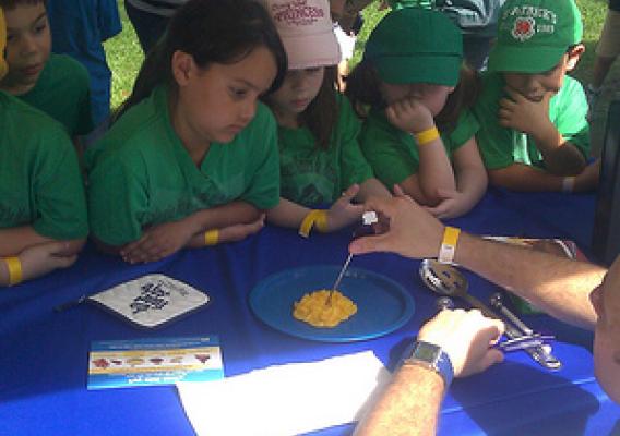 At the Food Safety Camp's "Cook" station, 4-H club members learn how to use a food thermometer and make sure snacks are cooked to a safe temperature.