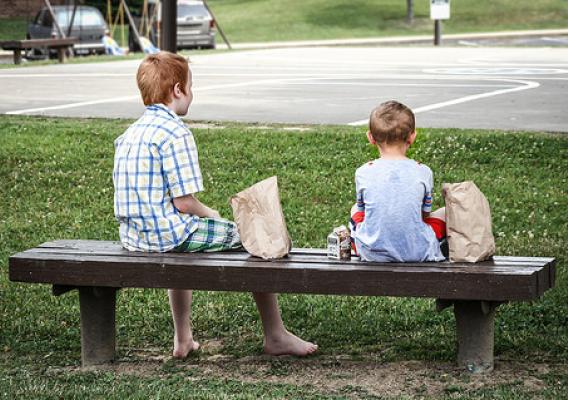 Two young boys enjoying lunch near their home in Knox County, Ky