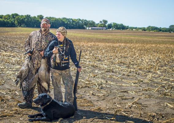 Justin Fevold and daughter Payton Fevold 14, from Gilmore City, Iowa, show off the results from a Youth Waterfowl hunting day outside of Gilmore City, Sept. 17, 2017.