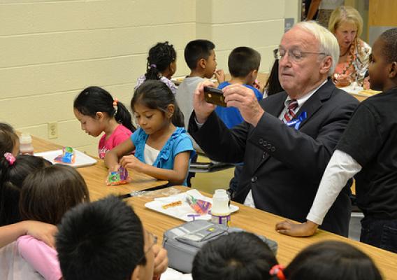 Under Secretary Kevin Concannon taking a photo of his lunch mates at Arcola Elementary School in Silver Spring, Md.