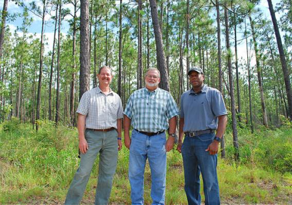 Jimmy Bullock with the Resource Management Service, Andrew Schock with The Conservation Fund and NRCS Alabama State Conservationist Ben Malone